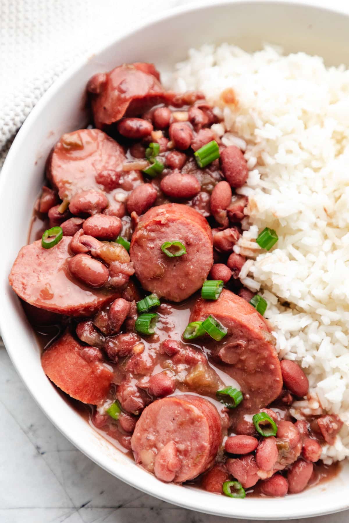 White rice and red beans in a white bowl. 