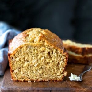 Butter knife with butter next to Banana Oatmeal Bread