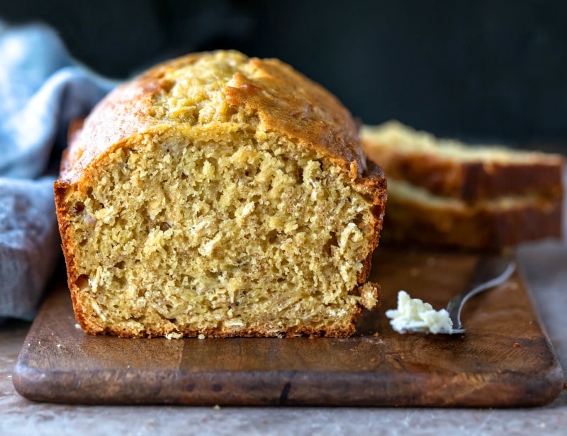 Banana Oatmeal Bread on a wooden cutting board