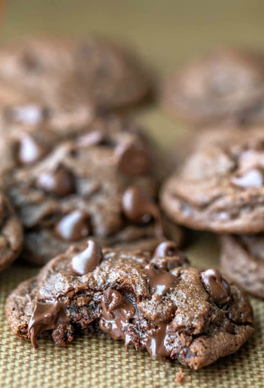Chocolate chocolate chip cookie with a bite missing