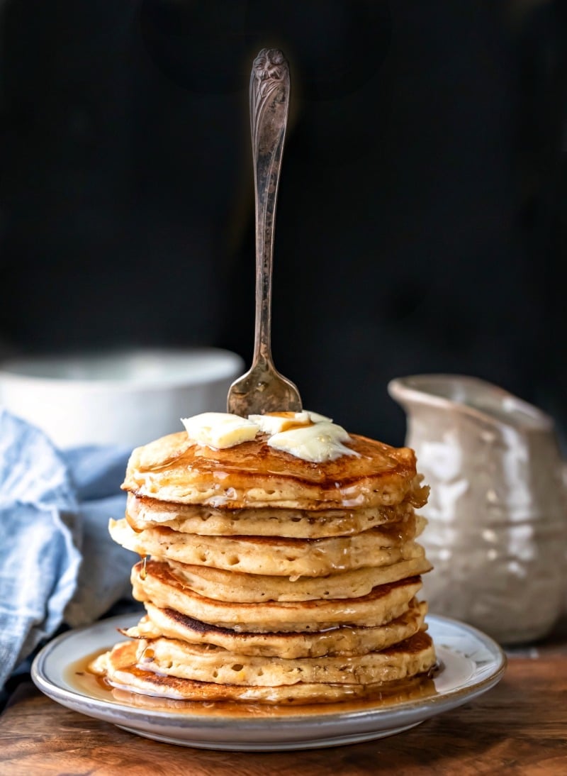 Stack of multigrain pancakes on a blue ceramic plate