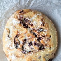 No Knead Cranberry Nut Bread on a piece of parchment paper