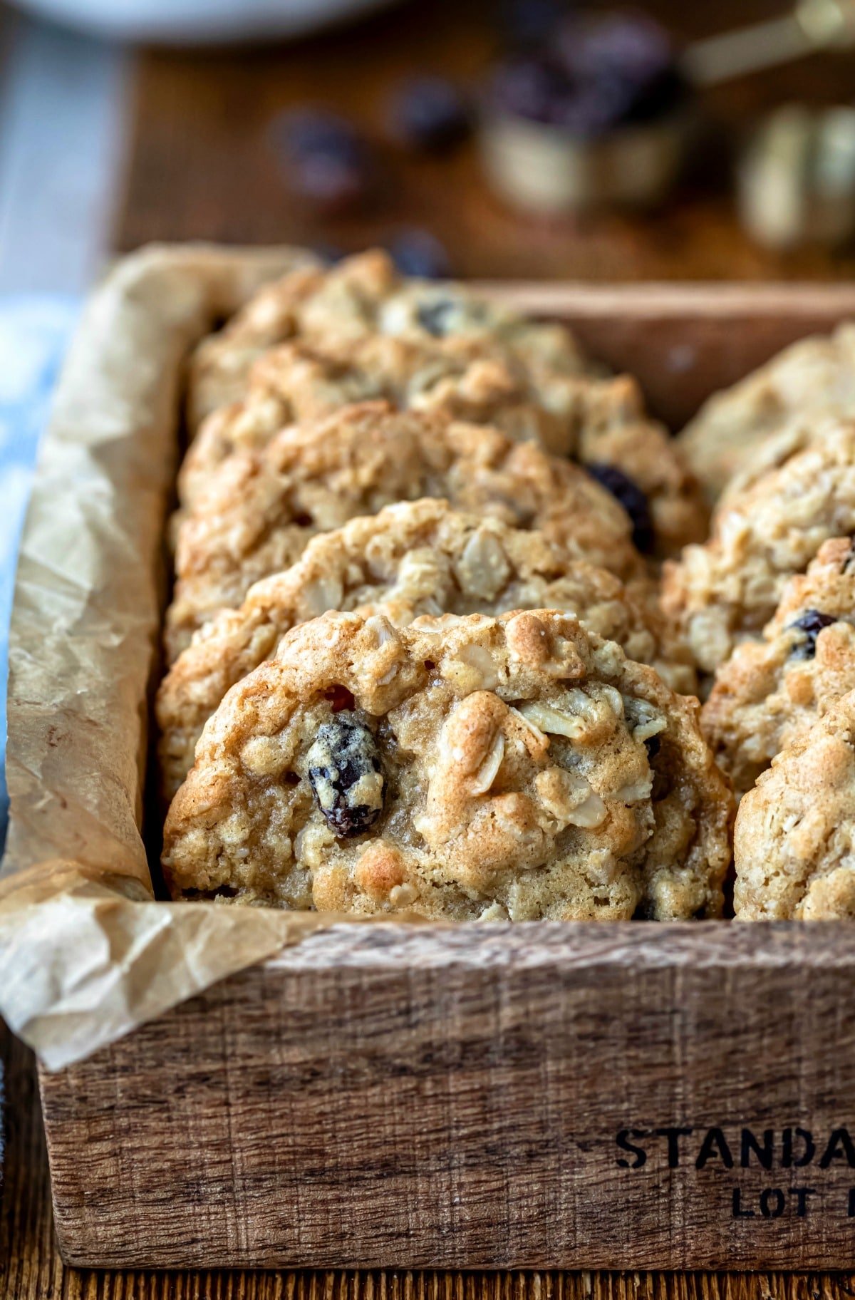 Oatmeal raisin cookies in a wooden box