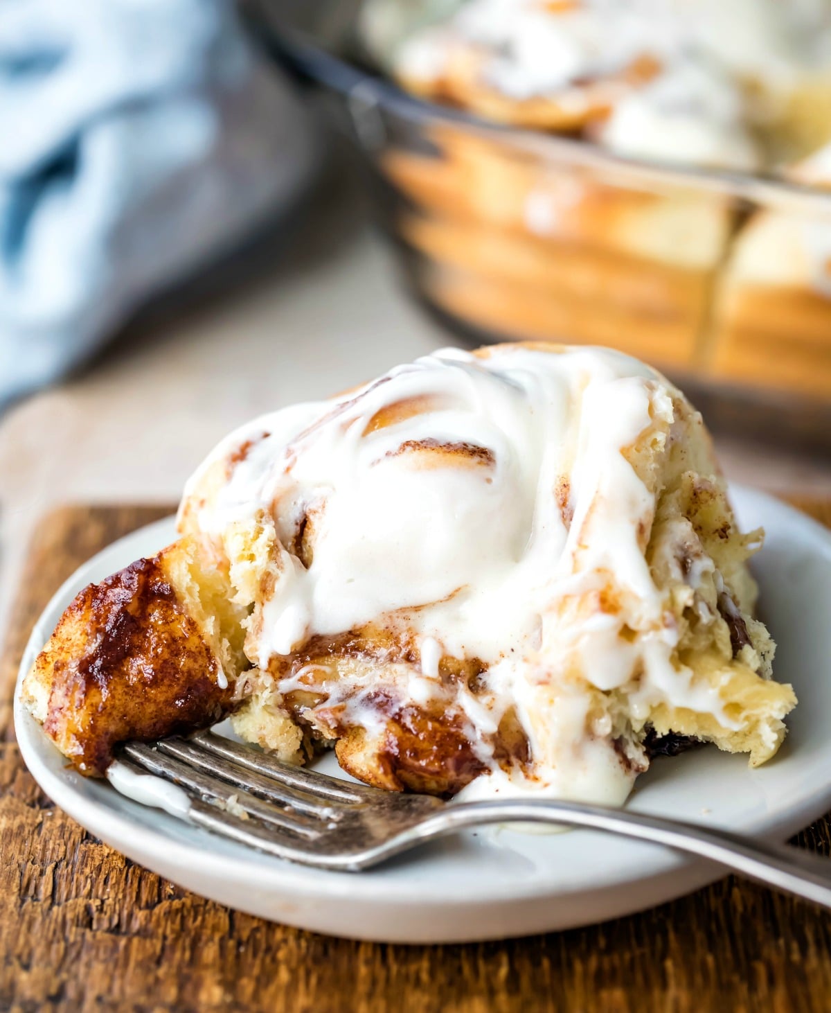 Homemade cinnamon roll with a bite on a fork