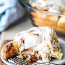 Homemade cinnamon roll on a white plate
