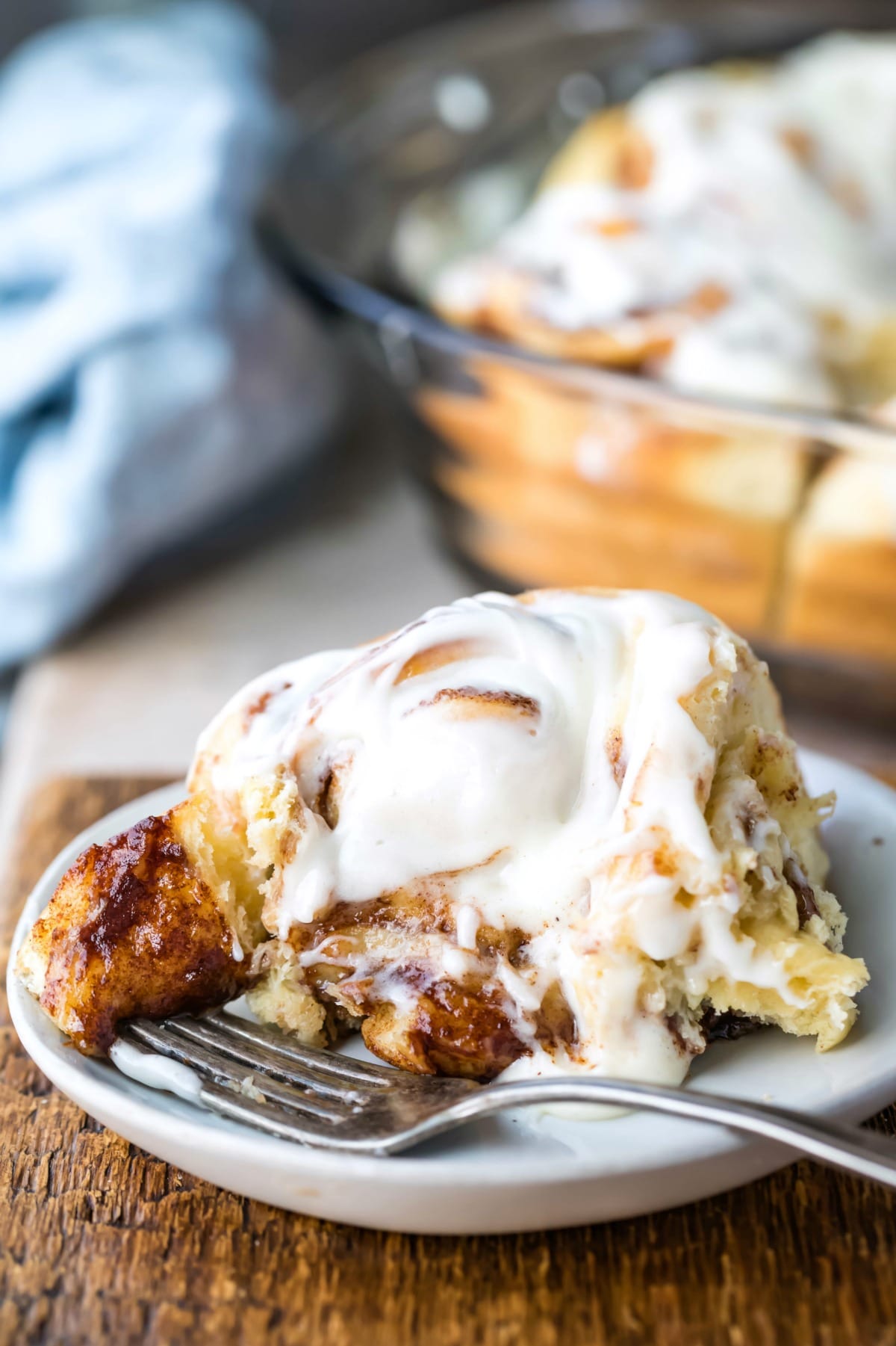 Homemade cinnamon roll on a white plate