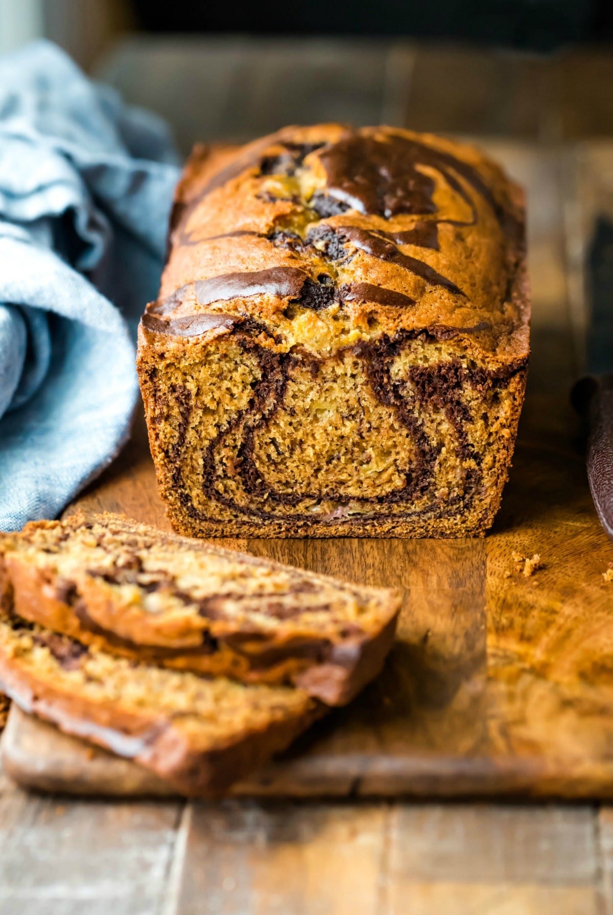 Marbled banana bread on a wooden cutting board