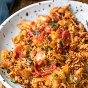 Cabbage roll bowls on a white and brown speckled plate