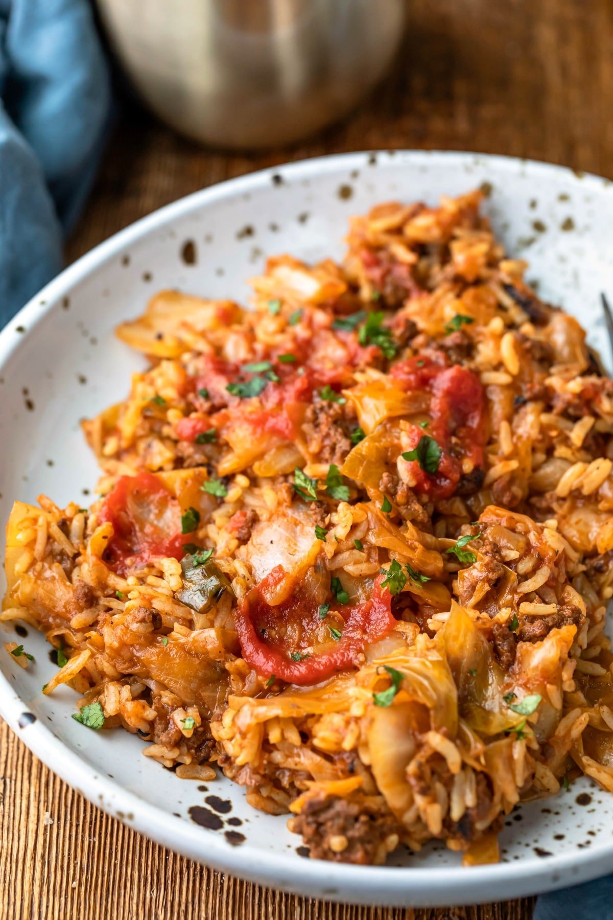 Cabbage roll bowls on a white and brown speckled plate