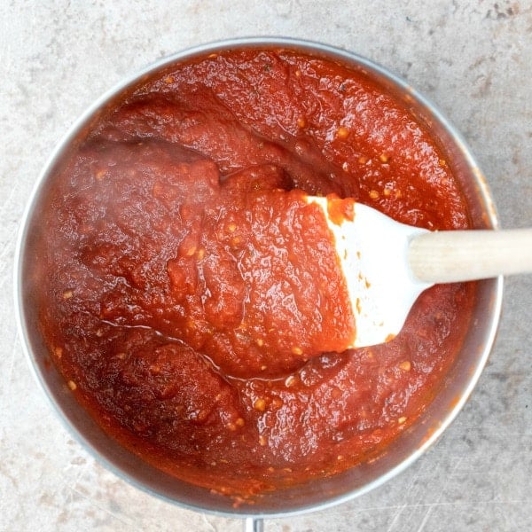 Spatula stirring homemade tomato sauce