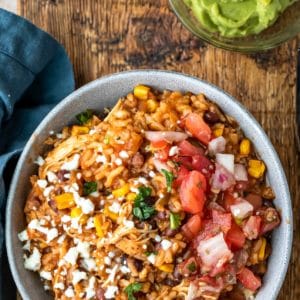 Burrito bowl topped with queso fresco and pico de gallo