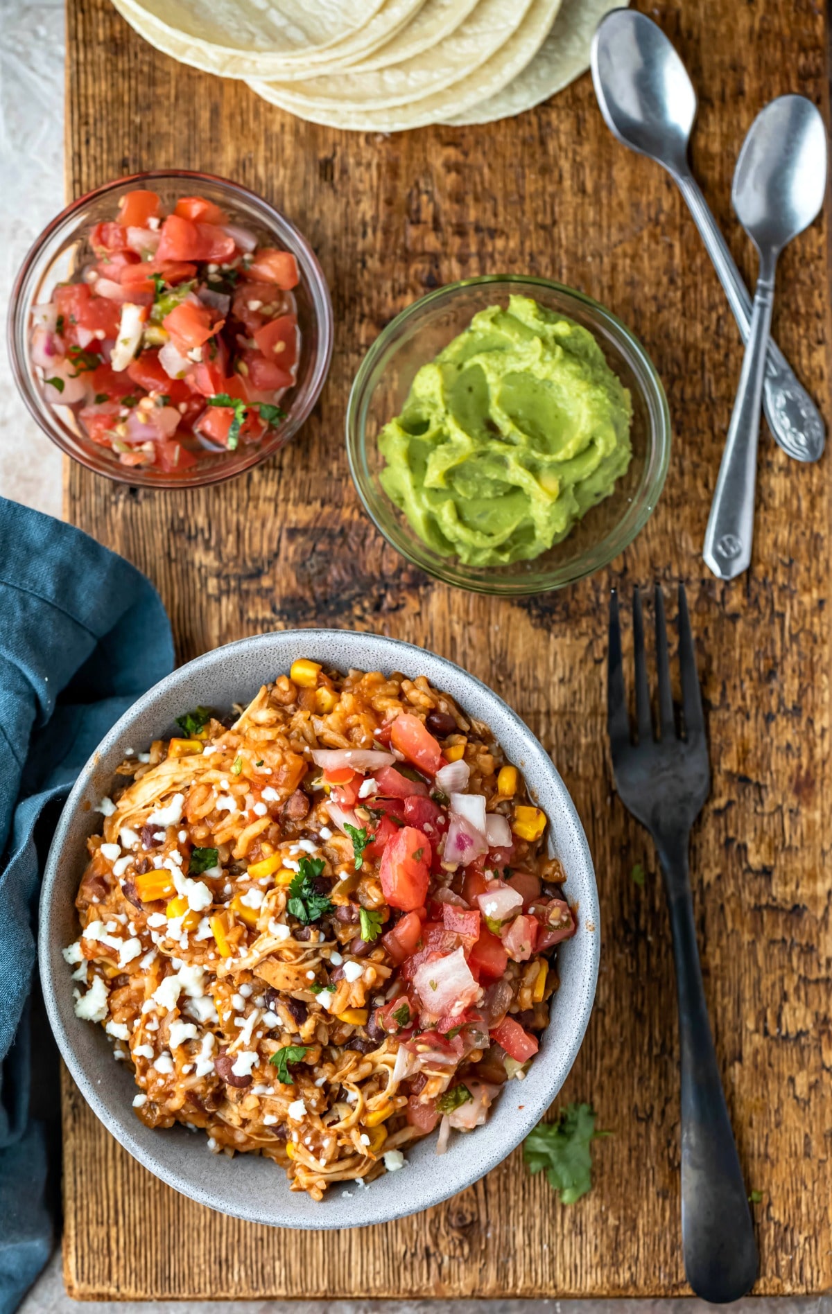 Instant Pot Chicken Burrito Bowls Chicken burrito bowl next to a black fork