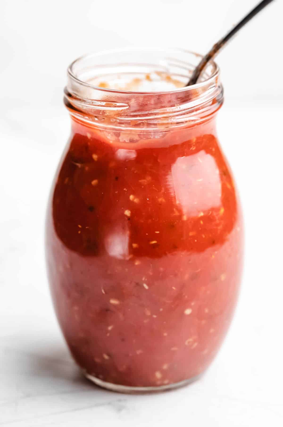 Homemade pizza sauce in a glass jar. 