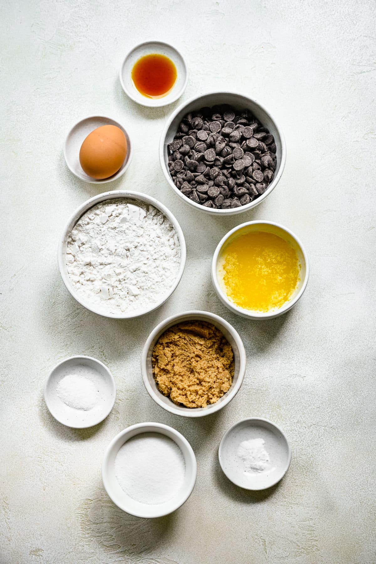 Ingredients for chocolate chip cookie bars in dishes. 