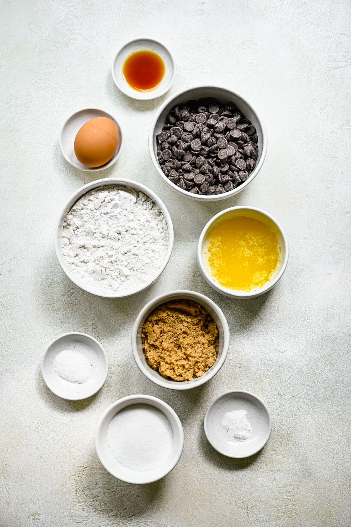 Ingredients for chocolate chip cookie bars in dishes.