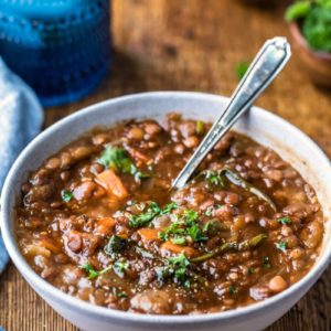Instant pot lentil soup in a blue stoneware bowl