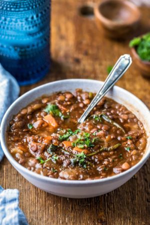 Instant pot lentil soup in a blue stoneware bowl