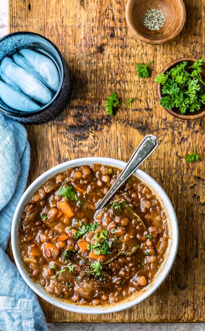 Bowl of Instant Pot Lentil Soup on a wooden cutting board