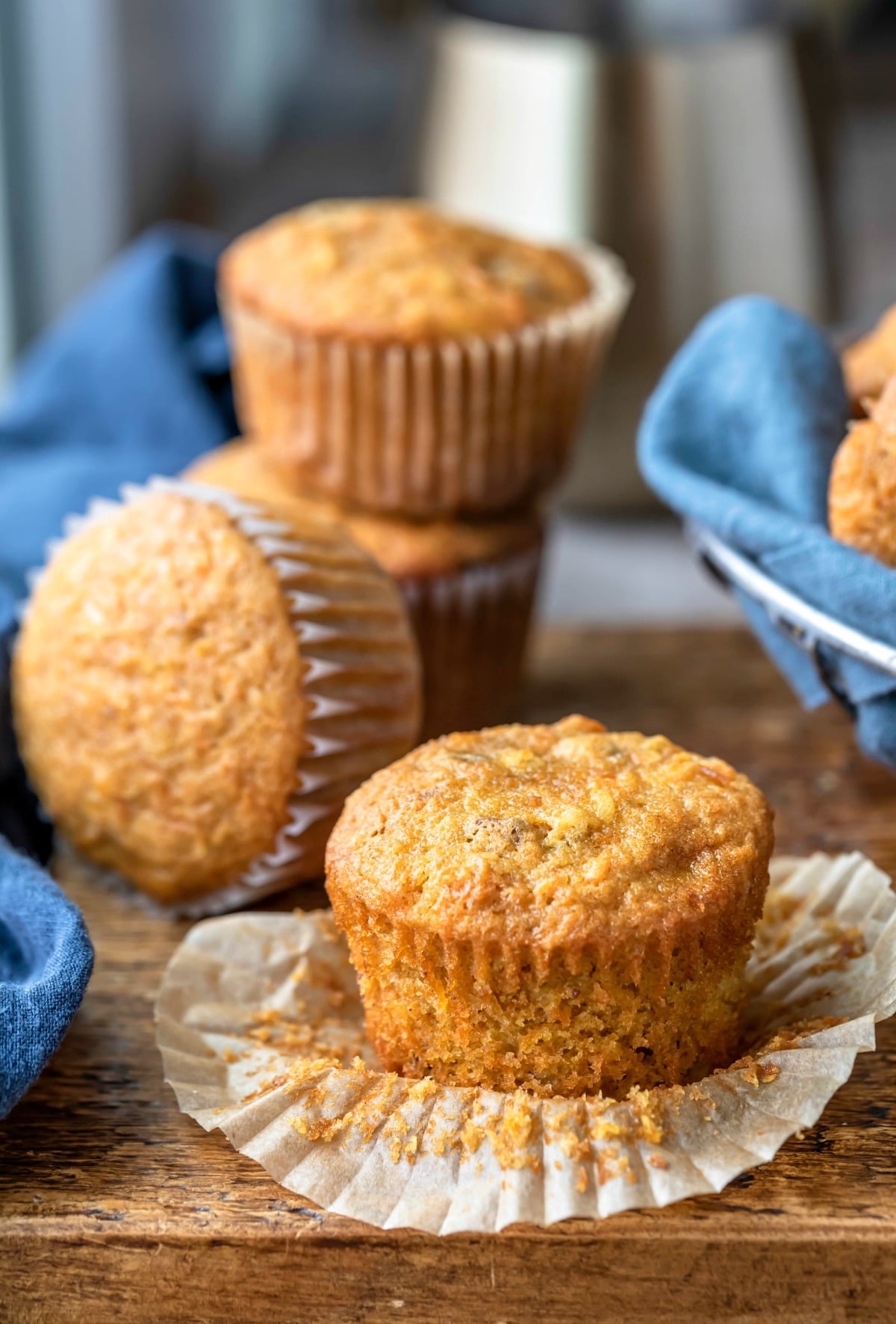 Carrot cake muffin with the parchment paper wrapper pulled down