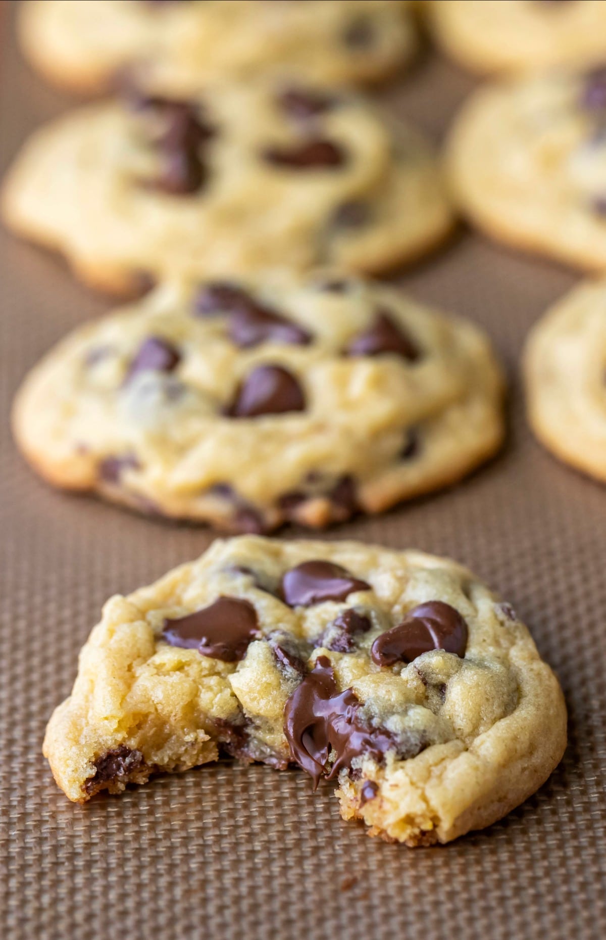 Chocolate chip pudding cookie with a bite out of it