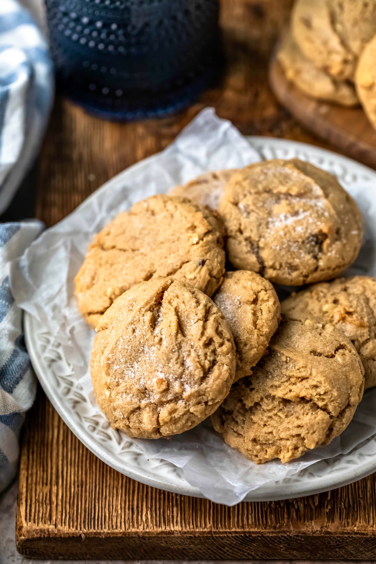 Plate of chewy peanut butter cookies on a wooden cutting board