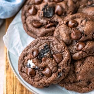 Stack of chocolate oreo cookies on a light blue plate