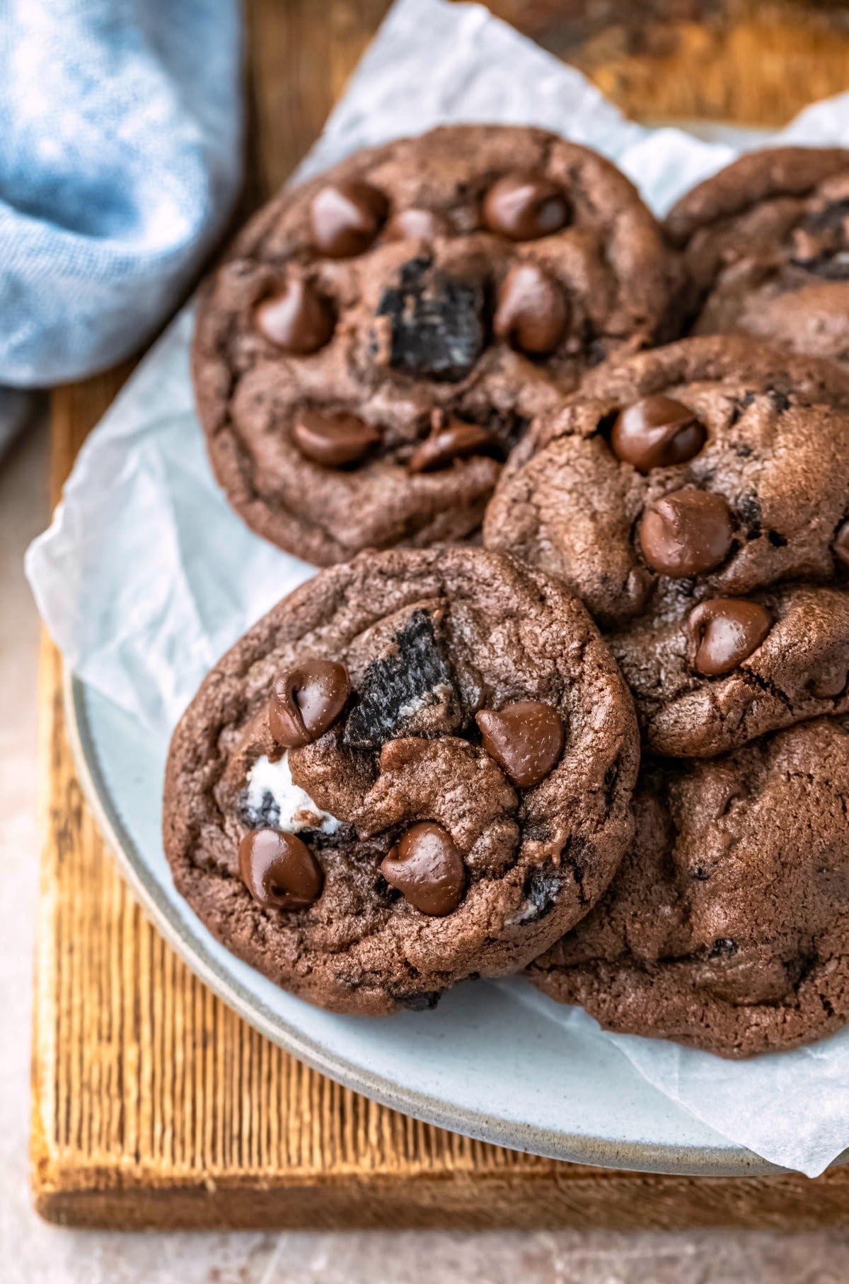 Stack of chocolate oreo cookies on a light blue plate