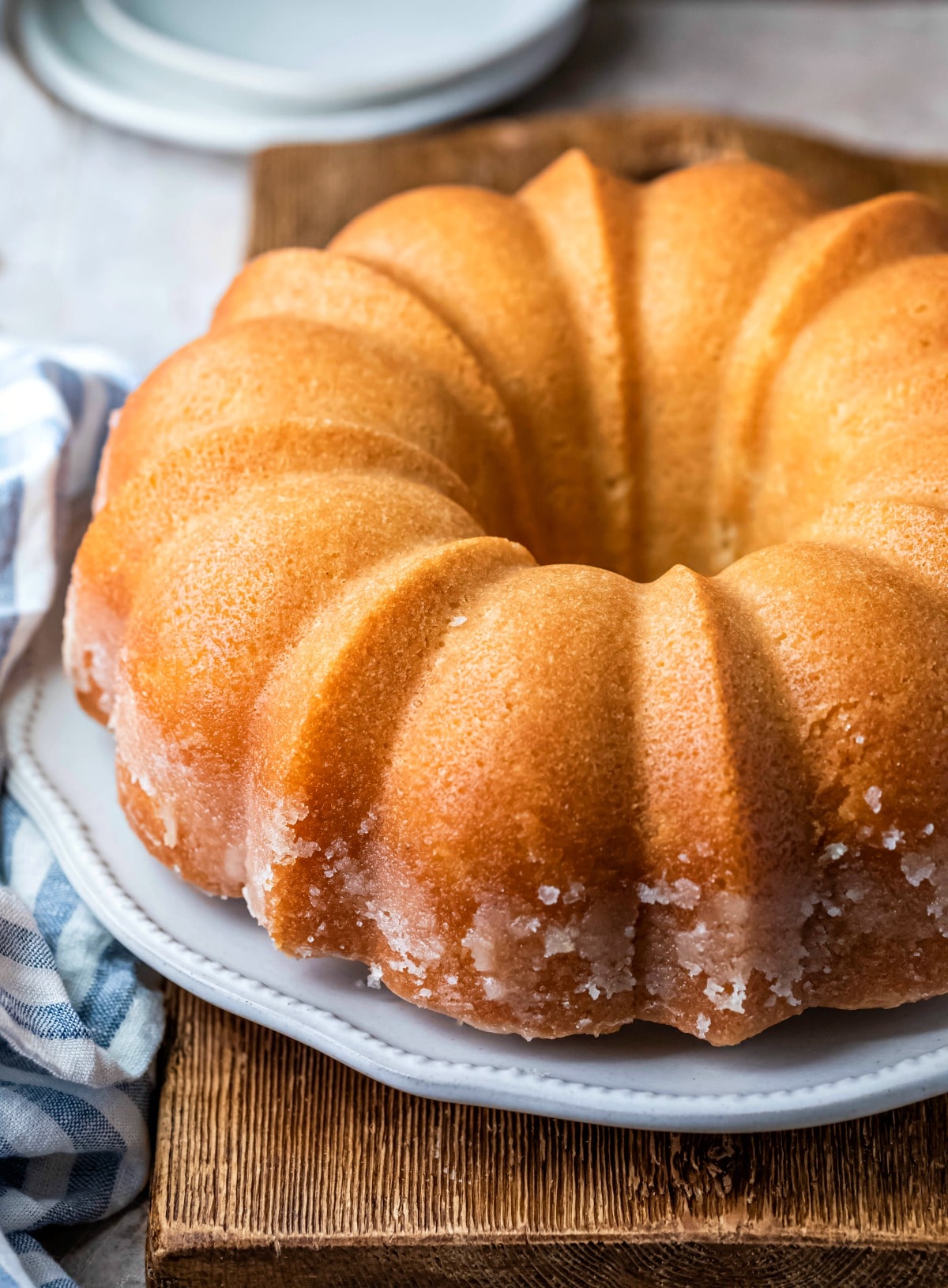 Whole kentucky butter cake on a white cake platter