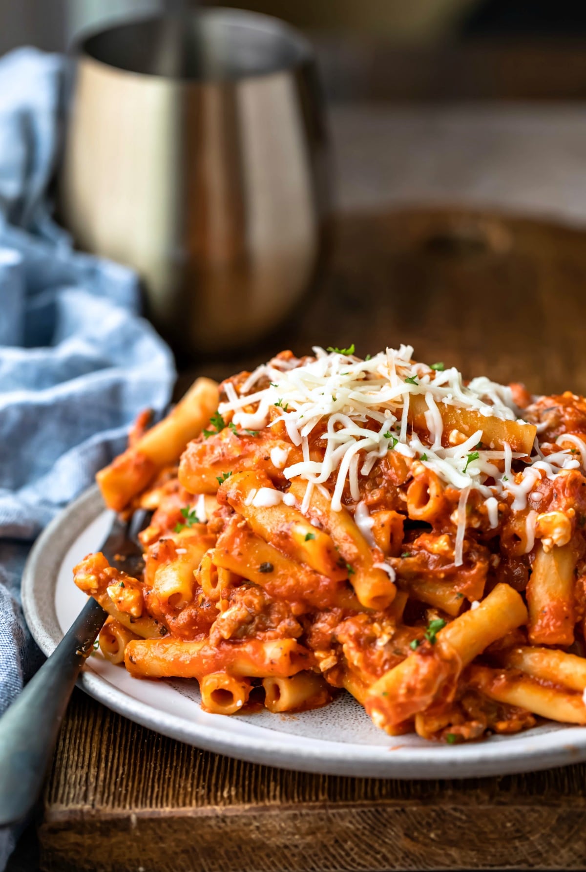 Plate of Instant Pot ziti next to a blue linen napkin