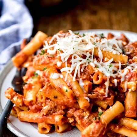 Plate of Instant Pot ziti topped with melted mozzarella cheese