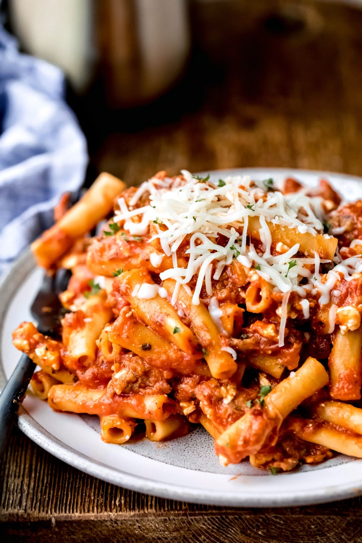 Plate of Instant Pot ziti topped with melted mozzarella cheese