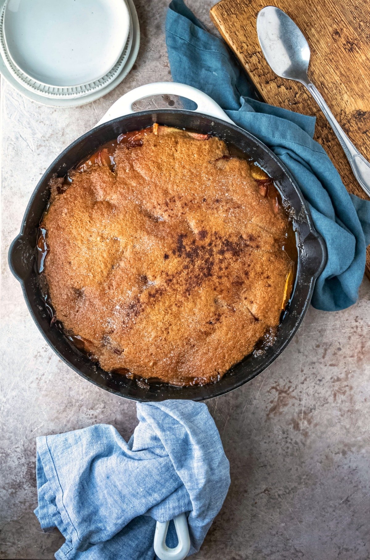 Brown sugar peach cobbler in a white skillet