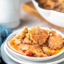 Brown Sugar Peach cobbler in three white dishes