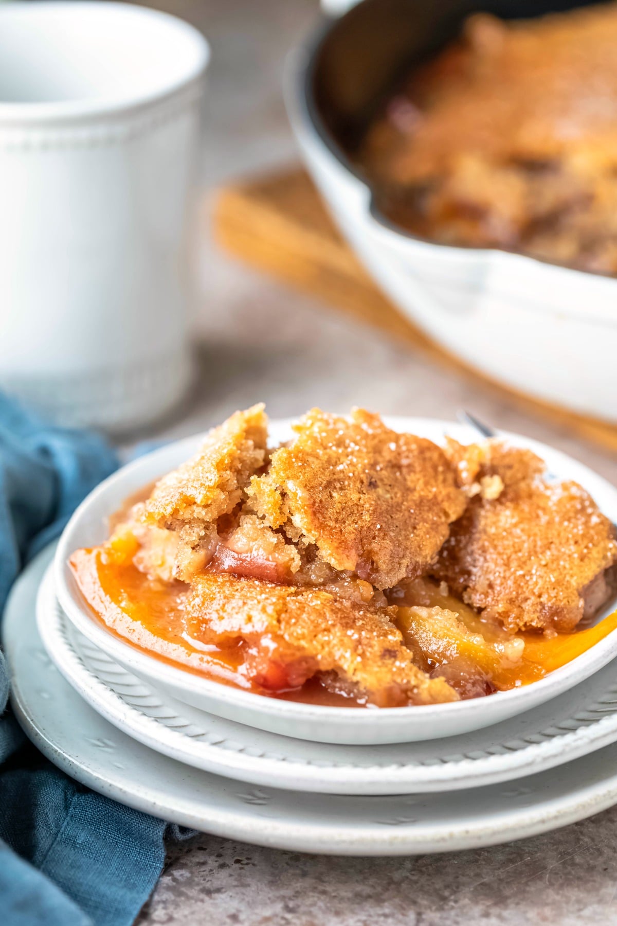 Brown Sugar Peach cobbler in three white dishes