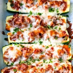 Zucchini boats filled with sausage sauce and cheese