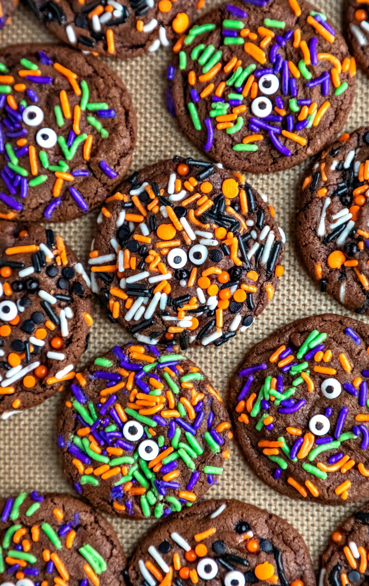 Halloween Monster Cookie Recipe Halloween monster cookies on a silicone baking mat