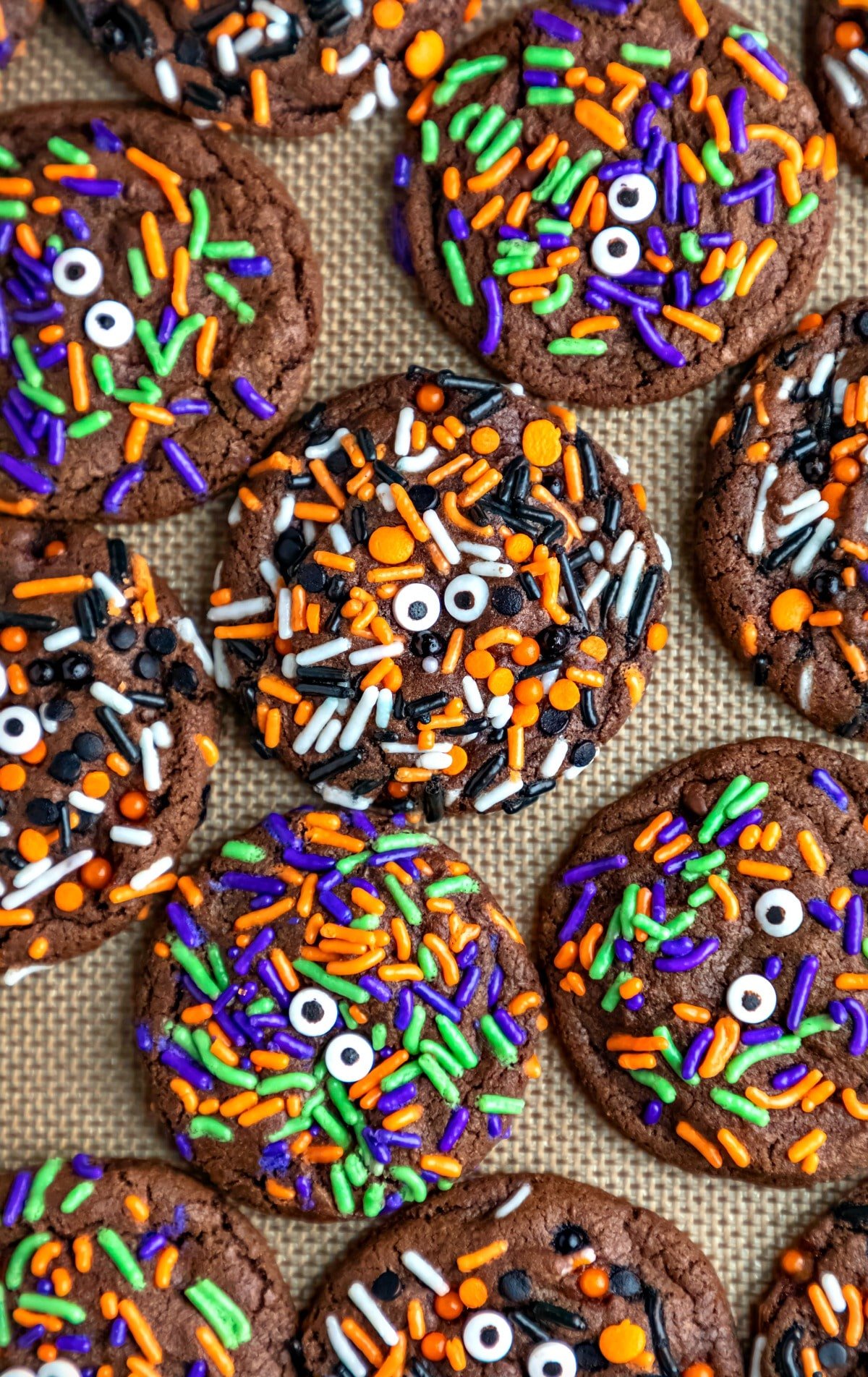 Halloween monster cookies on a silicone baking mat