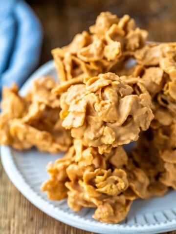 Plate of butterscotch cornflake cookies on a wooden cutting board