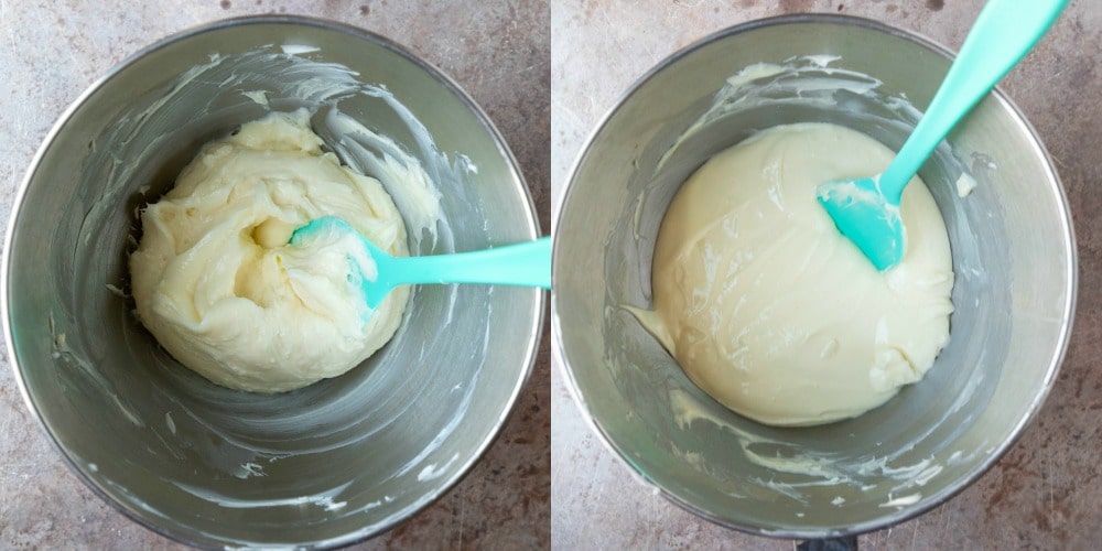 Beaten cream cheese in a silver mixing bowl.