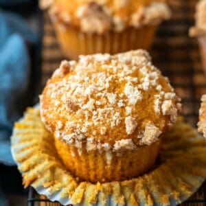 Pumpkin Streusel Muffins on a black wire cooling rack