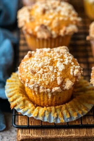 Pumpkin Streusel Muffins on a black wire cooling rack