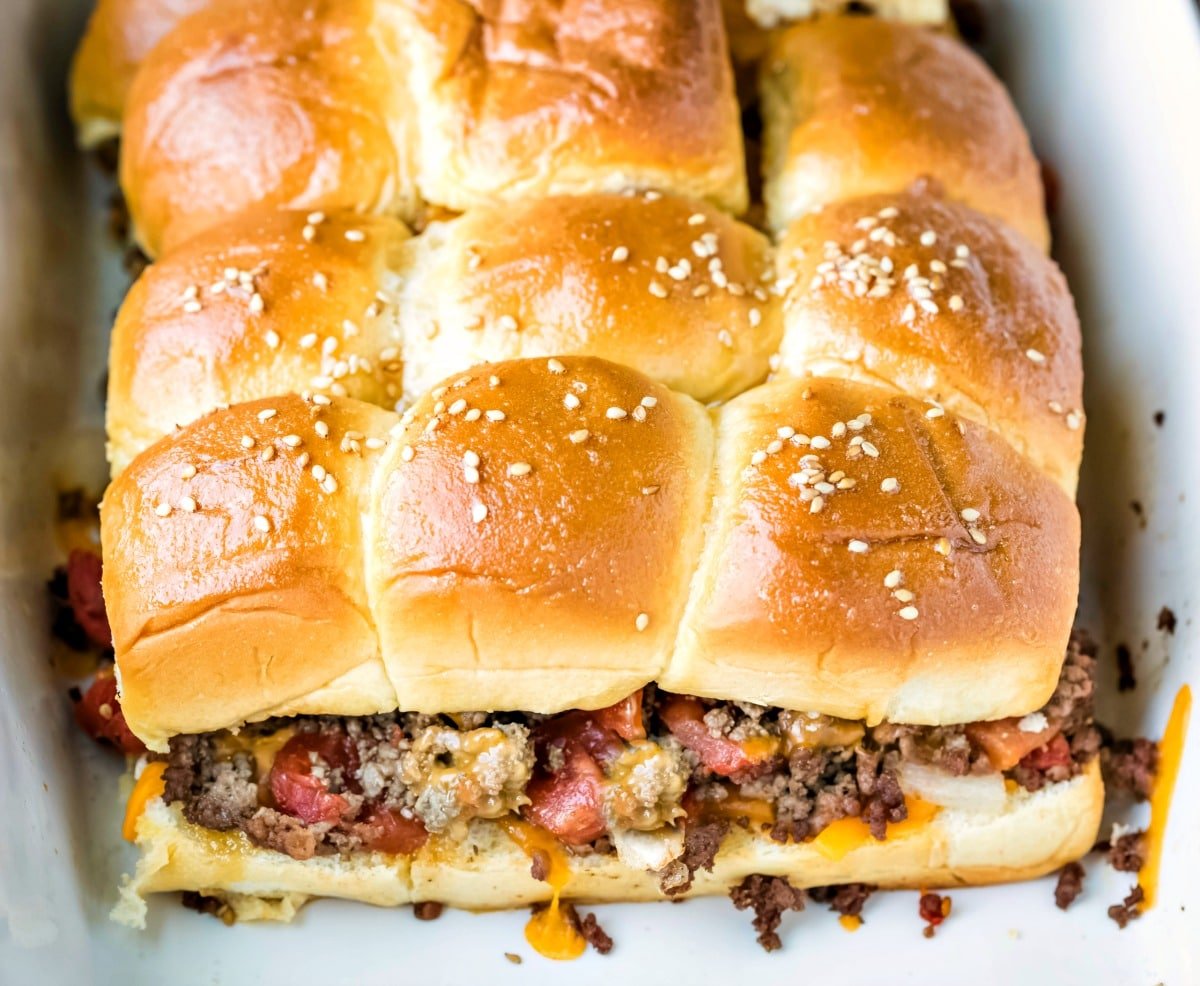 Baked cheeseburger sliders in a white baking dish