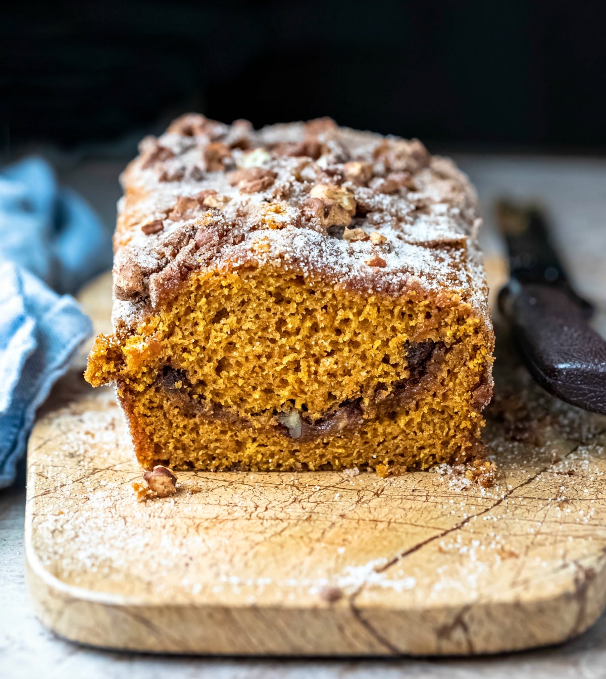 Loaf of pumpkin bread with a slice cut off the end