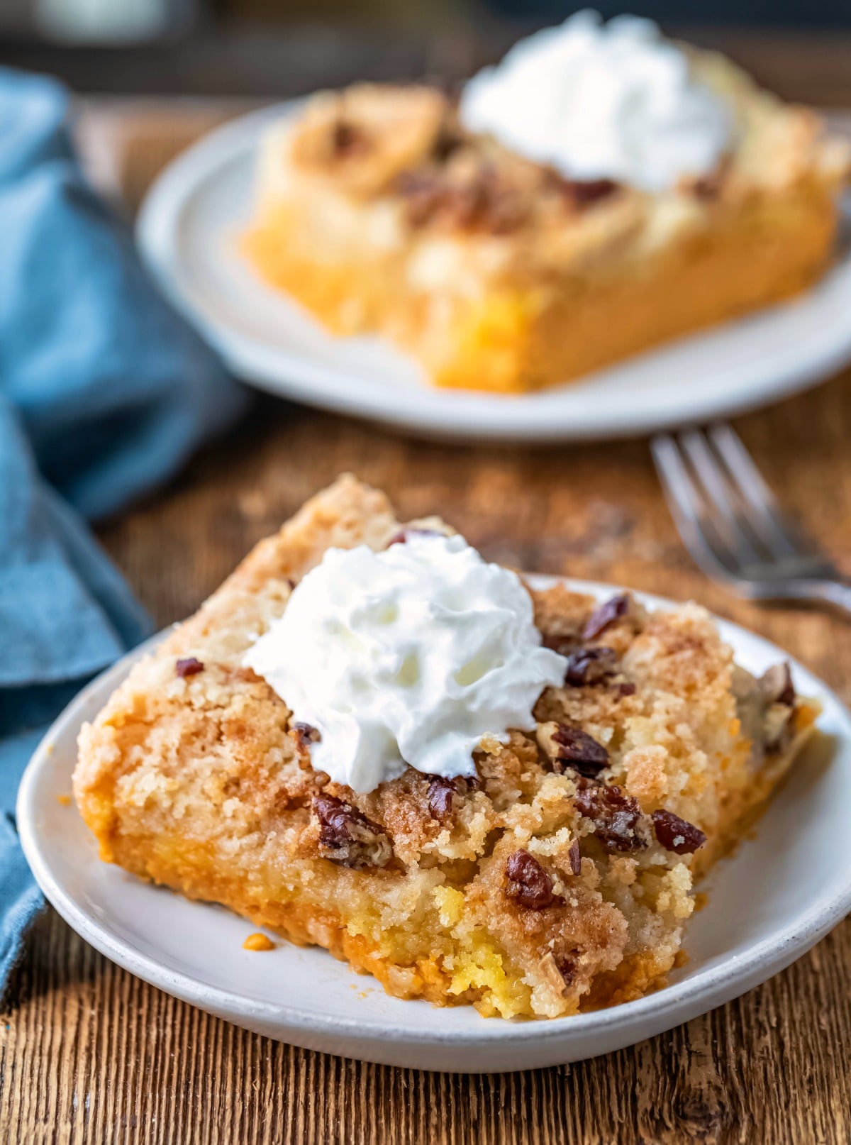 Pumpkin pie cake topped with a dollop of whipped cream