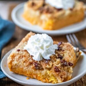 Two slices of pumpkin pie cake on white plates