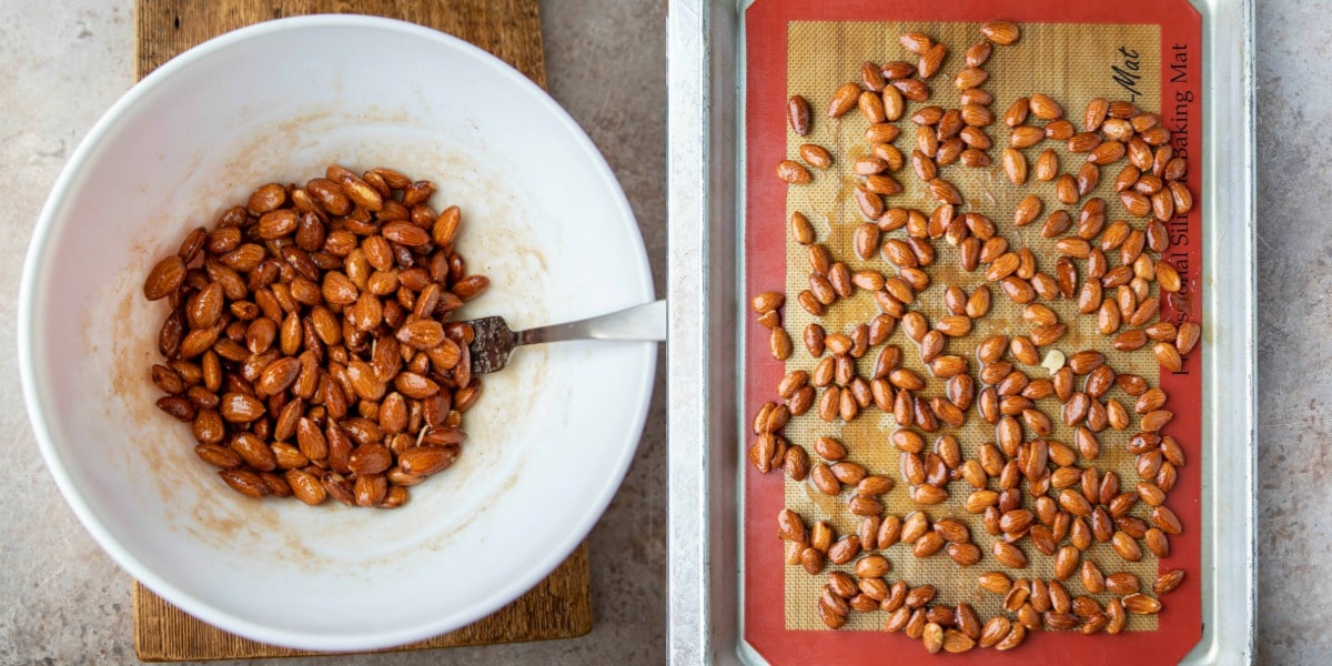 Unbaked cinnamon almonds on a half sheet pan