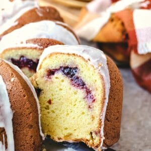 Knife cutting a slice of cranberry orange pound cake