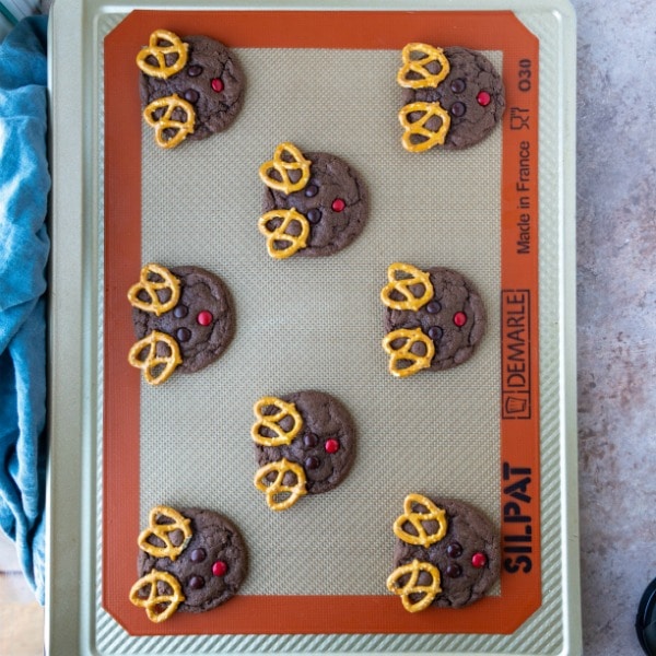 Baked reindeer cookies on a baking sheet