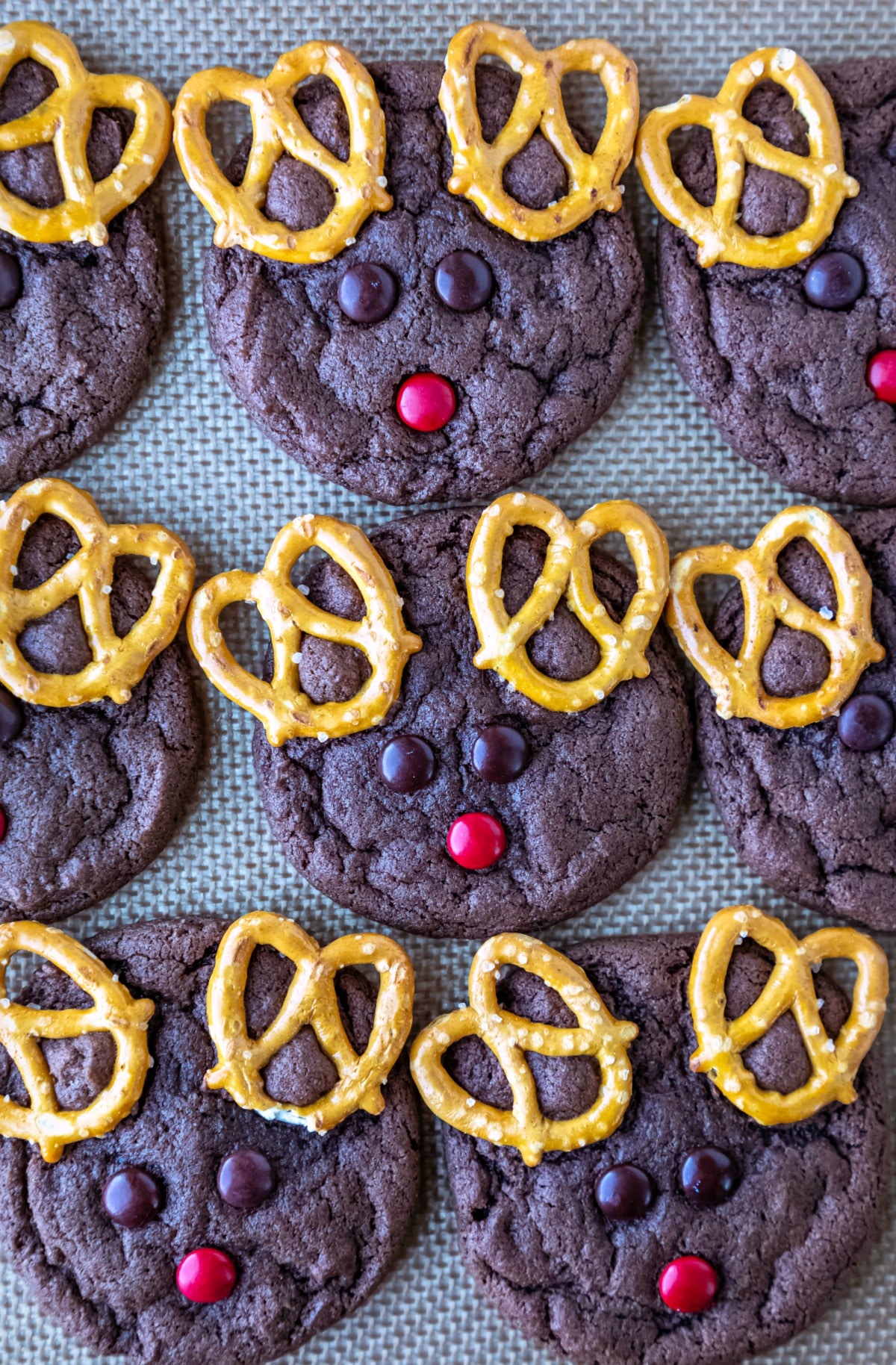 Reindeer cookies on a silicone baking mat