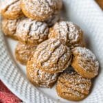 White hobnail glass plate with pfeffernusse cookies on it